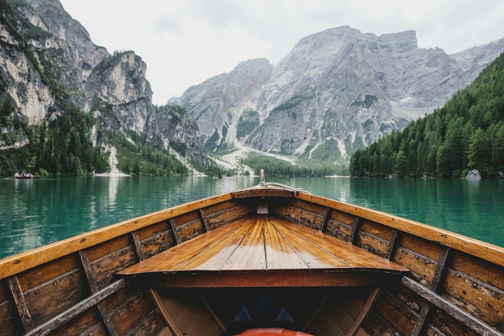 A blue lake tucked between green mountains